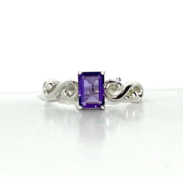 A silver ring with an amethyst