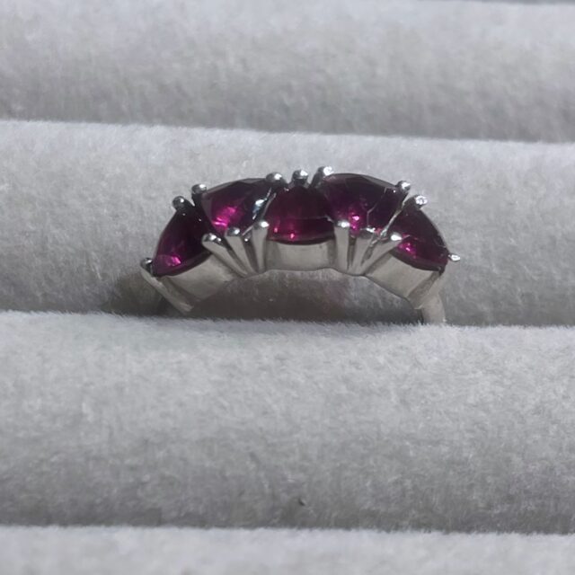 A silver ring with garnets