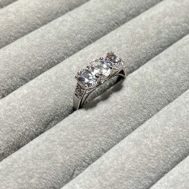 A gold ring with morganites and diamonds