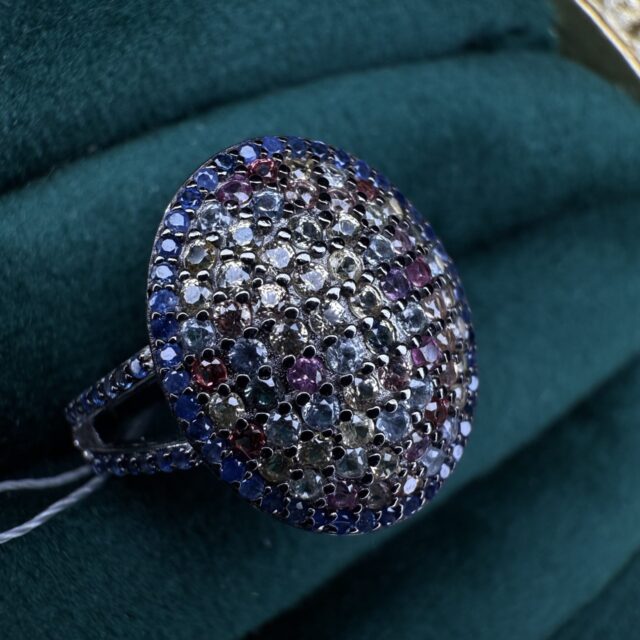A silver ring with sapphires