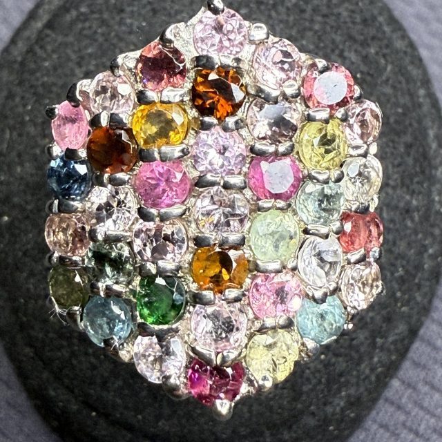 A silver ring set with gemstones